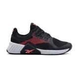 Championes deportivos Reebok Flip Charge para hombre, color negro con detalles en naranja y suela blanca.