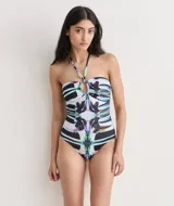 Malla entera con estampado abstracto en tonos negro, blanco, celeste y verde.