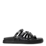 Sandalias bajas color blanco con tiras finas y tachas plateadas.