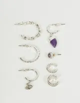 Set de seis aros bañados en plata, incluye dos cuffs, un aro pasante con amatista y tres argollas, una con dije de ojo turco y otra con dije de cuerno.