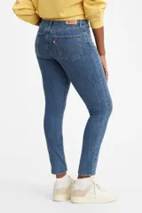 Jeans de tiro alto color azul medio, corte skinny.