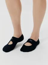 Medias negras con diseño de calzado Mary Jane y logo bordado en blanco.