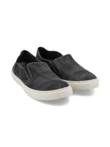 Zapatillas slip-on azules de algodón orgánico con suela de caucho natural.