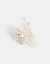 Broche para el pelo color crema con forma de moño.