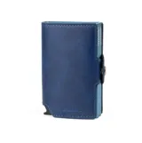 Billetera compacta de cuero sintético color azul marino, con mecanismo de eyección de tarjetas y cierre a presión.