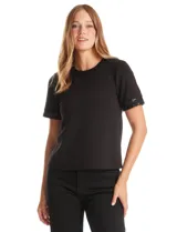 Blusa negra de modal con cuello a la base y espalda con abertura de ojal y botones. Presenta apliques de lentejuelas en el cuello y las mangas.