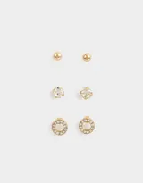 Set de tres pares de aros pasantes dorados con strass. Incluye un par de aros tipo bolita, un par con strass transparente y un par con strass y centro nacarado.