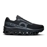 Championes de running On Cloudmonster 2, color negro con detalles en gris.