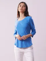 Remera de algodón color verde agua, con escote redondo y mangas 3/4.