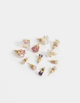 Set de seis pares de aros pasantes con strass en distintos formatos y tonalidades.