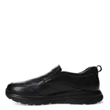 Zapato de vestir negro de cuero, sin cordones, con elásticos laterales y suela gruesa.
