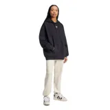 Canguro Adidas Essentials Oversized negro con capucha, cordón ajustable, bolsillo tipo canguro y logo Adidas bordado en blanco en el pecho.