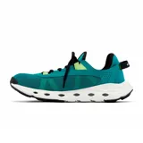 Zapatillas Columbia Drainmaker XTR para hombre, color negro con detalles en verde y suela beige. Diseño sin cordones, con capellada de malla de secado rápido, entresuela ligera con puertos de drenaje y suela de goma con micro ranuras para mayor tracción.