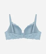 Soutien femenino modelo base con relleno hueco, confeccionado en encaje rústico. Posee tirantes finos ajustables y un pequeño lazo con medalla aplicada en el centro.