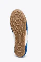 Zapatillas deportivas de estilo running, color azul con detalles en blanco y suela marrón.