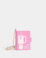 Llavero con dije de libreta rosa de silicona con diseño en relieve de un vaso con sorbete y la frase "I'm just a girl".