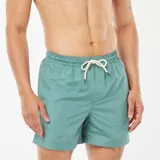Short de baño verde con estampado geométrico en blanco y cordón ajustable en la cintura.