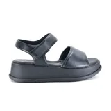 Sandalias negras de cuero con plataforma y ajuste con velcro.