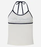 Top frente única color crema con estampado de texto "Stanley Park" en azul marino y ribetes negros.