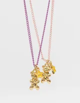Set de dos collares con cadena de eslabones, uno color lila y otro rosa, con dije de oso dorado y dije de estrella dorada con la inscripción BFF.