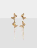 Aros colgantes largos dorados con dos mariposas y strass.