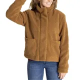 Chaqueta polar de mujer color negro, con cuello alto y cierre frontal con broches ocultos. Tiene bolsillos laterales y un bolsillo interior en el pecho. Presenta logo de Caterpillar en el bolsillo.