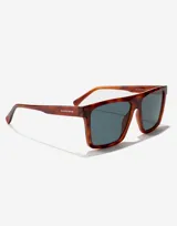 Lentes de sol Hawkers modelo Aspen, unisex, con montura rectangular color carey y lentes grises.