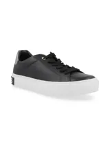 Zapatillas urbanas Hush Puppies de cuero negro con suela blanca y detalle plateado en el talón.