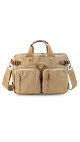 Mochila de tela canvas color beige con detalles en cuero marrón. Cuenta con múltiples bolsillos con cierre, compartimento acolchado para notebook y correas ajustables.