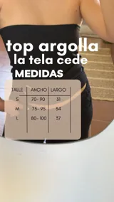 Top blanco sin mangas, confeccionado en tejido rib elástico, con detalle de argolla en la parte delantera.