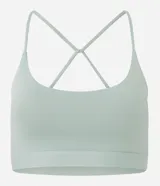 Top deportivo negro confeccionado en microfibra sin estampa, con espalda abierta y breteles finos cruzados.