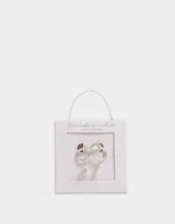 Aros argolla bañados en plata con dije de moño y cubic zirconia.