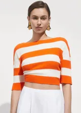 Falda midi evasé de algodón y lyocell color blanco, con tiro medio y cierre trasero invisible.