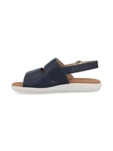 Sandalia azul marino de cuero con ajuste de velcro y suela blanca.