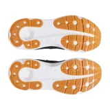 Zapatillas Under Armour negras con capellada de malla y detalles sintéticos, entresuela blanca con tecnología HOVR+ y suela de goma color caramelo.