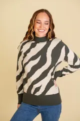 Buzo de algodón y elastano con diseño de rayas a rayas en contraste de color beige y negro, con cuello alzado y puños ajustados.