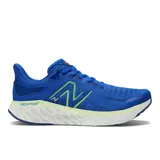 Championes de running New Balance modelo 1080, color azul con detalles en verde y blanco. Cuentan con tecnología Fresh Foam X en la entresuela y empeine Hypoknit.