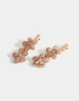 Set de dos hebillas para el pelo con apliques de flores color rosa claro.