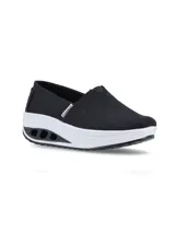 Zapatillas Hush Puppies tipo slip-on, color celeste, confeccionadas en tela canvas con elástico en el empeine y plantilla con memory foam.