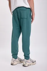 Pantalón de jogging verde petróleo con cintura ajustable con cordón.