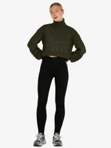 Pantalón de jean negro de tiro alto y corte skinny.