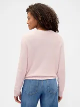 Buzo de algodón negro con cuello redondo, manga larga y tejido de punto con trenzas y calados en el frente.