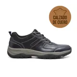 Zapato casual de cuero negro, con cordones y suela de goma gris.