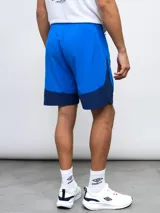 Short de entrenamiento azul marino y azul eléctrico, con escudo del Club Nacional de Football estampado en el lateral.