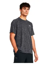 Remera deportiva Under Armour Tech™ para hombre, color negro jaspeado, de corte suelto y tejido ligero y transpirable. Cuenta con logo de la marca en el pecho.