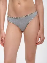 Colaless blanca de algodón con ribete de animal print.