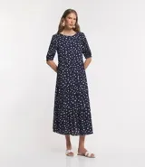 Vestido largo de viscosa color azul marino con estampado de lunares blancos, cuello redondo, manga corta abullonada y corte midi.