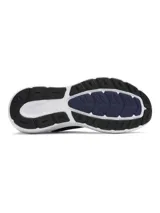 Championes de running Under Armour Charged Rogue 5, color azul marino con detalles en amarillo neón y suela blanca.