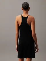 Vestido corto negro de lyocell con textura de canalé, corte recto y tirantes finos con espalda racerback.