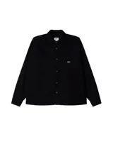 Camisa negra de manga larga con botones, bolsillo en el pecho y logo Obey bordado en blanco.